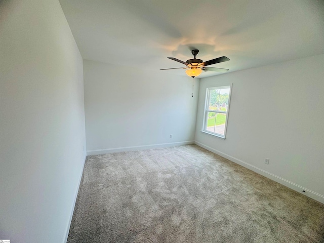 spare room with carpet and ceiling fan