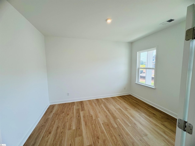 spare room featuring light hardwood / wood-style floors