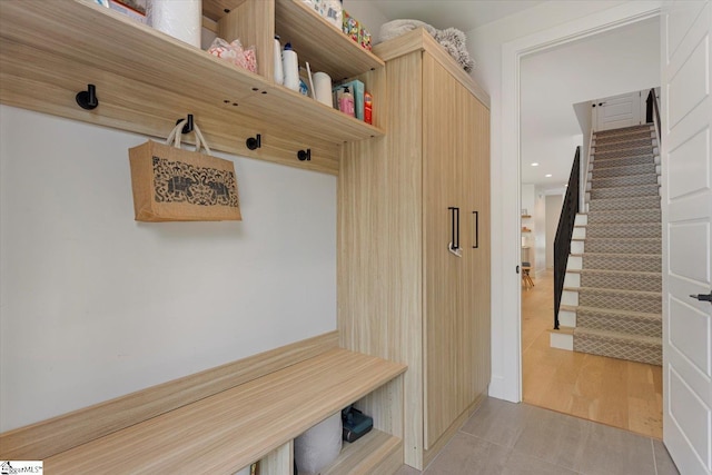 mudroom with light hardwood / wood-style floors