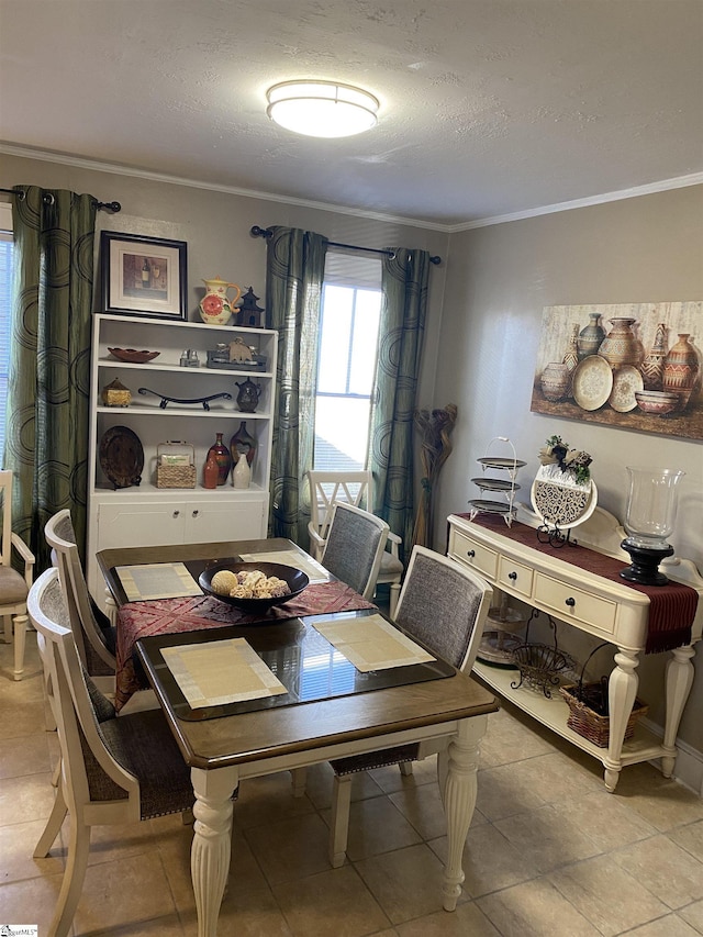 dining area featuring crown molding and a textured ceiling