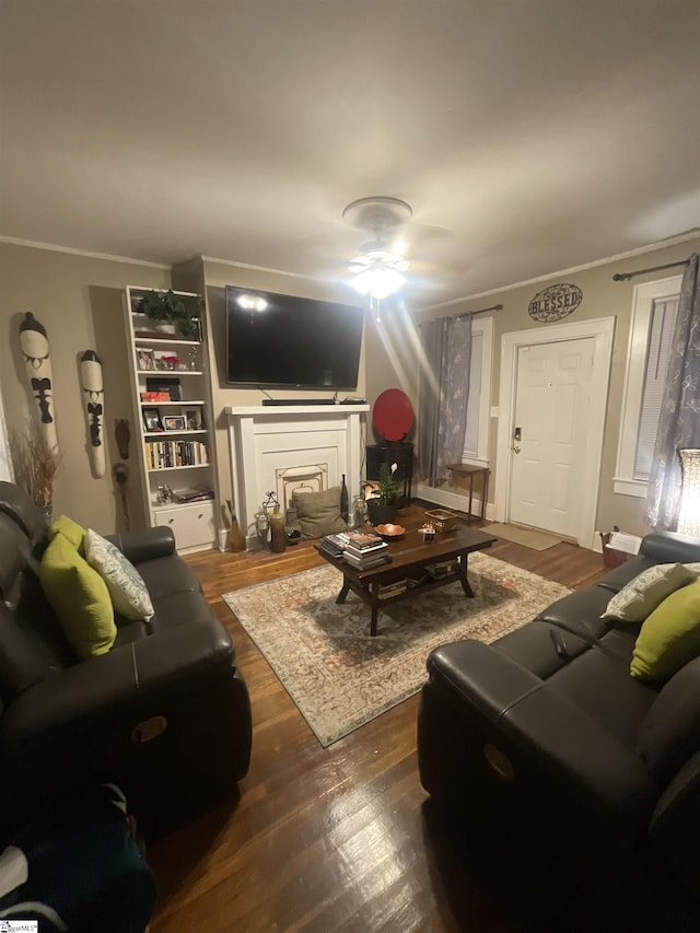 living room with crown molding and dark hardwood / wood-style floors