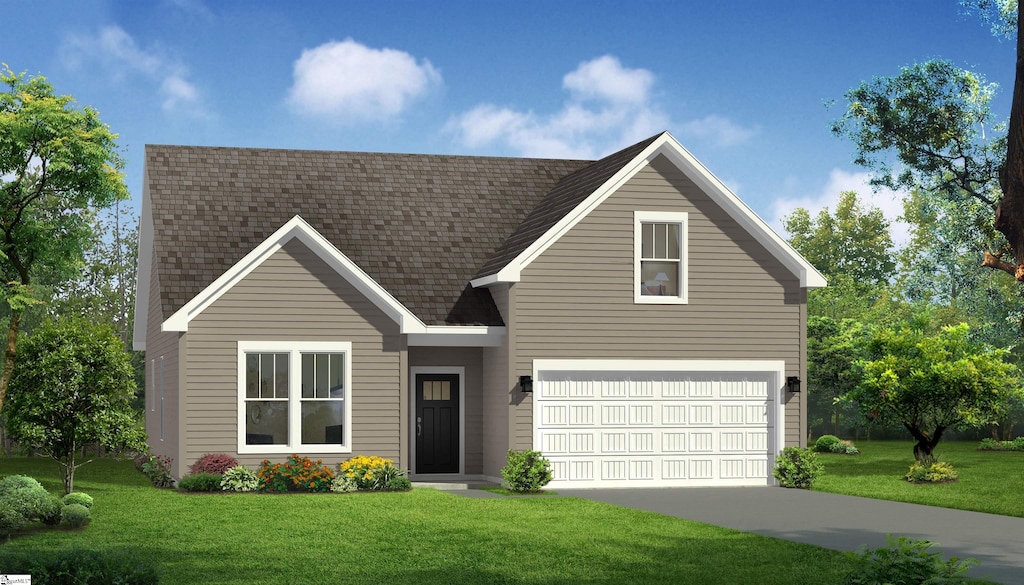 view of front of home with a garage and a front yard