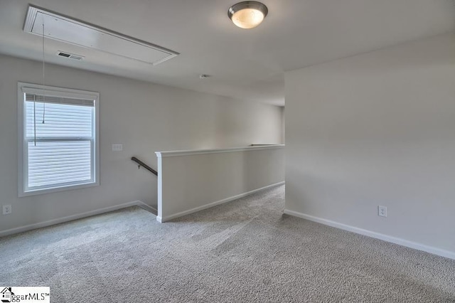 empty room featuring light colored carpet