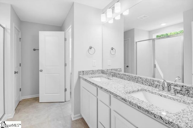 bathroom with vanity and walk in shower