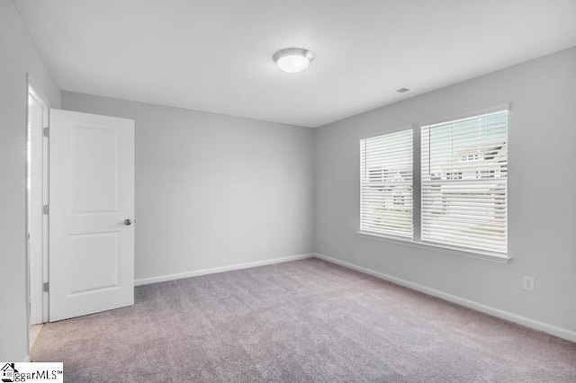 view of carpeted spare room