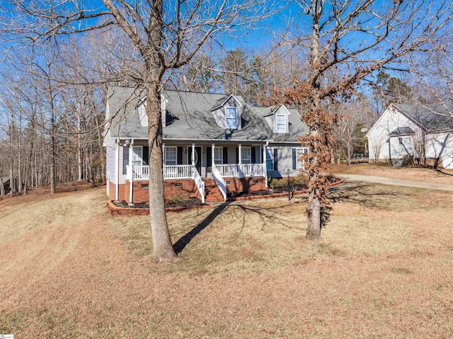 cape cod house featuring a front lawn and a porch