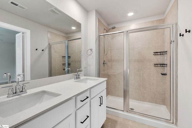 bathroom with walk in shower and vanity