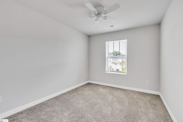 carpeted empty room with ceiling fan