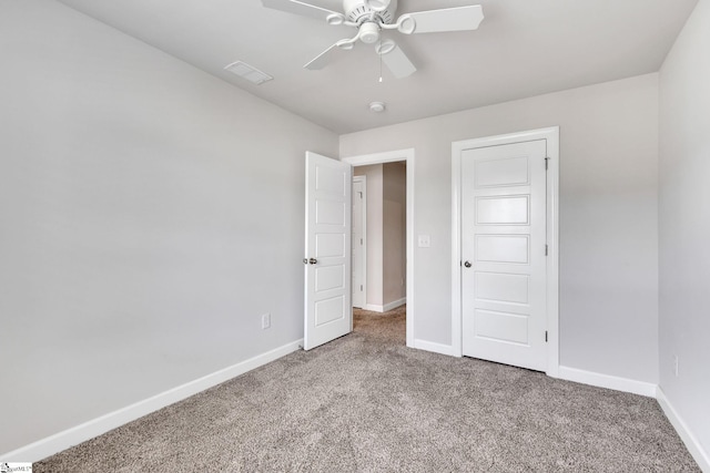 unfurnished bedroom with ceiling fan and carpet floors