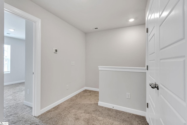 empty room with light colored carpet