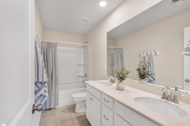 full bathroom featuring shower / bath combination with curtain, tile patterned floors, toilet, and vanity