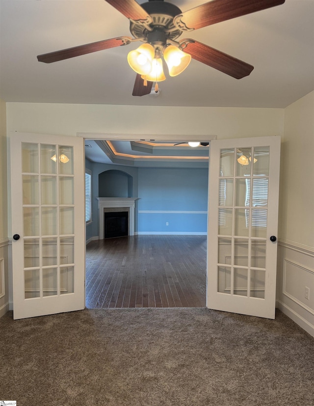 carpeted empty room featuring french doors