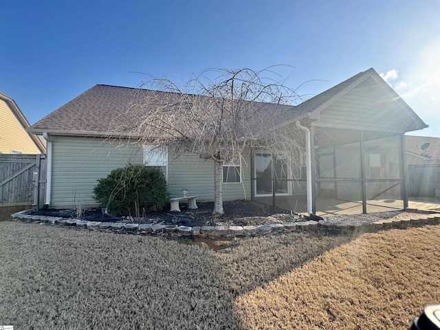 rear view of property with a patio area and a lawn