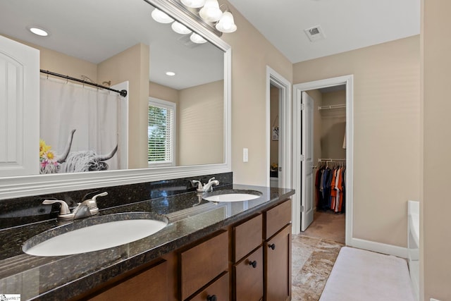 bathroom featuring vanity and shower with separate bathtub