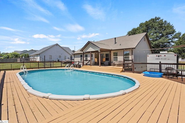 view of pool featuring a wooden deck