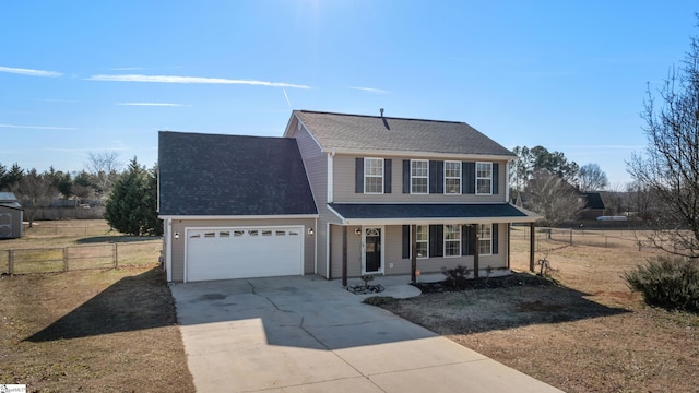 view of front of property featuring a garage, a front lawn, and a porch