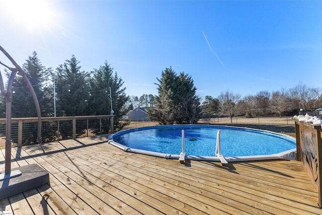 view of pool with a wooden deck