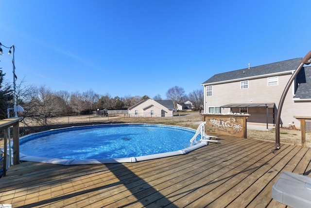 view of pool with a wooden deck