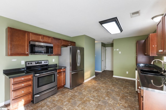 kitchen featuring appliances with stainless steel finishes and sink