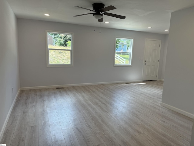 unfurnished room featuring ceiling fan and light wood-type flooring