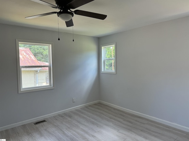 unfurnished room featuring light hardwood / wood-style flooring and ceiling fan