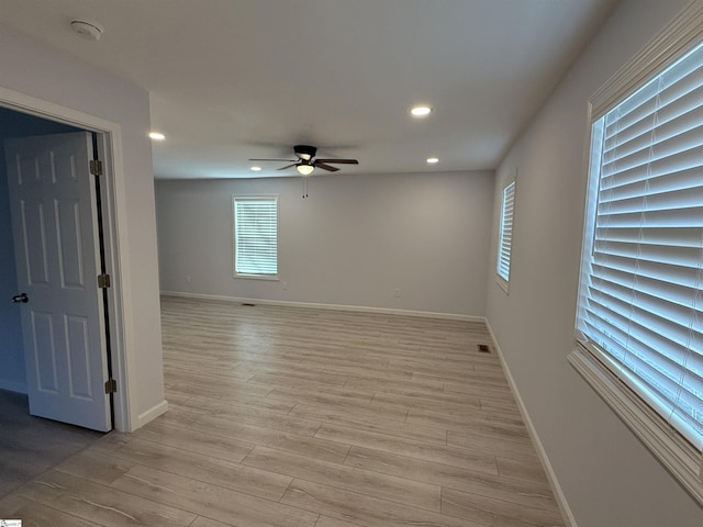 empty room featuring light hardwood / wood-style floors and ceiling fan