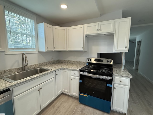 kitchen featuring sink, white cabinets, and appliances with stainless steel finishes