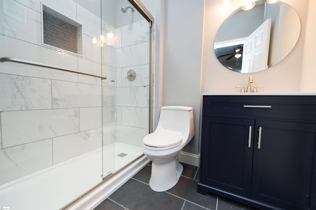 bathroom with walk in shower, vanity, toilet, and tile patterned flooring