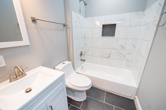 full bathroom with vanity, tile patterned flooring, tiled shower / bath combo, and toilet