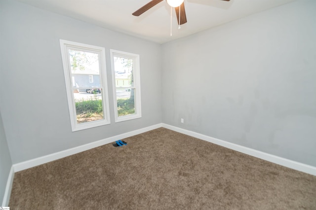 spare room with ceiling fan and carpet floors