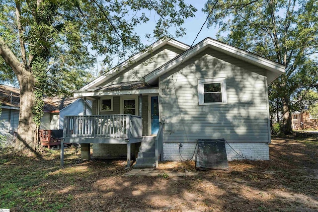 exterior space featuring a wooden deck