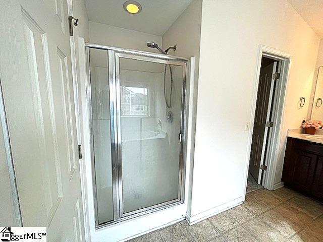 312 Engelmann Ln, Simpsonville, SC 29680 - bathroom with vanity and a shower with shower door