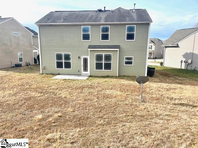 312 Engelmann Ln, Simpsonville, SC 29680 - rear view of property with central AC, a patio area, and a lawn