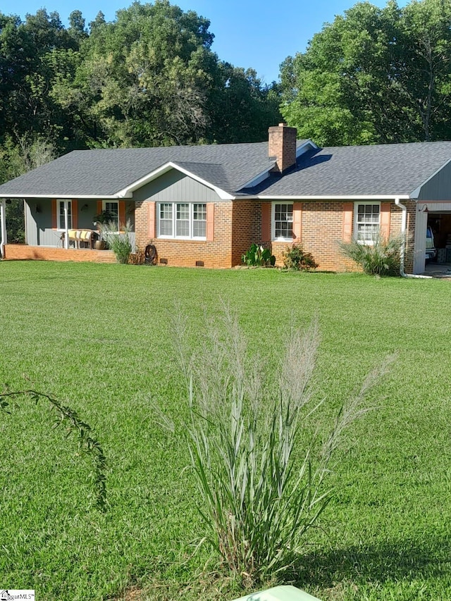 ranch-style house with a porch and a front lawn