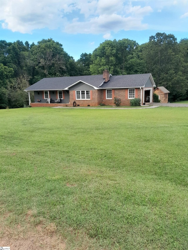 single story home with a front yard and covered porch