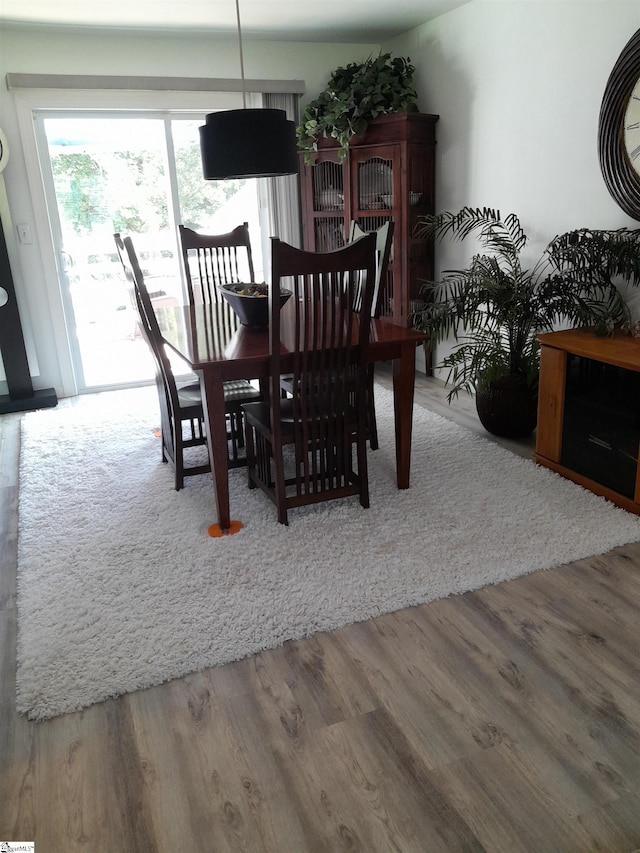 dining area with hardwood / wood-style flooring