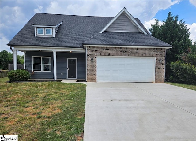 view of front of house with a garage and a front lawn