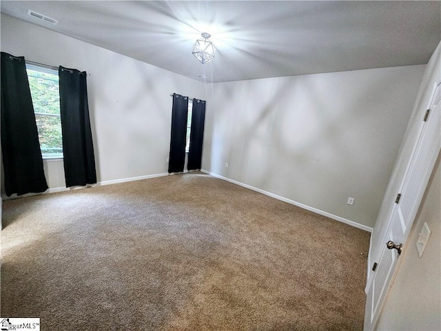 spare room with carpet flooring