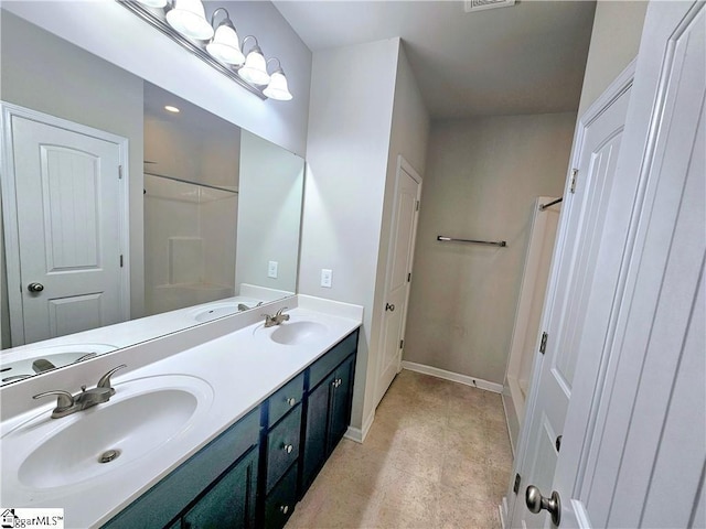 bathroom with vanity and tile patterned floors