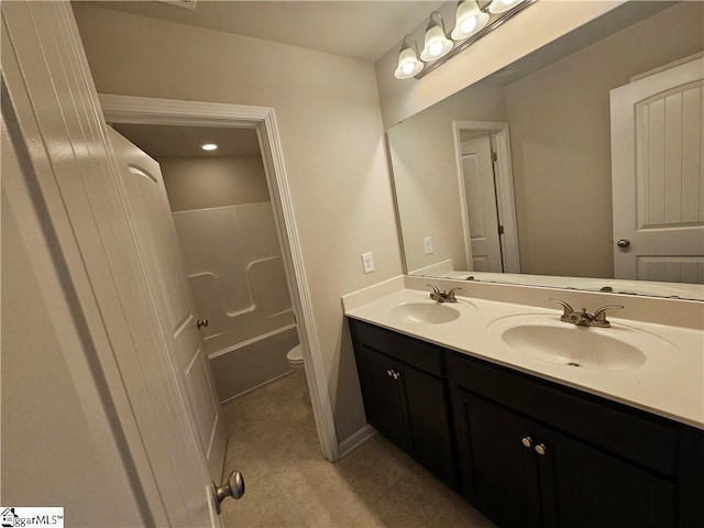 full bathroom with vanity, shower / bathing tub combination, tile patterned floors, and toilet