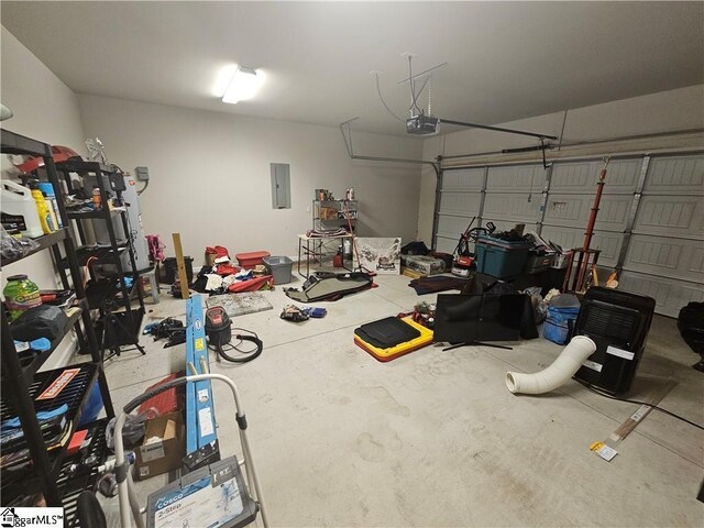 garage featuring a garage door opener and electric panel