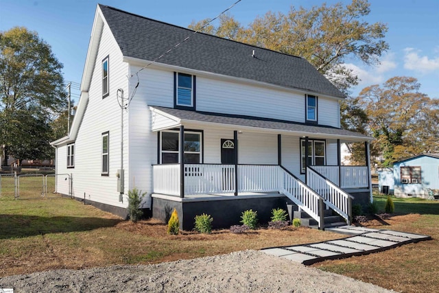 view of front of property featuring a front lawn and a porch