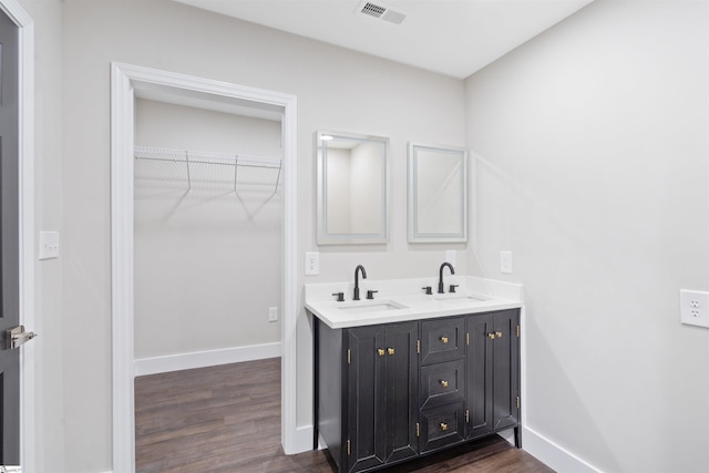 bathroom featuring vanity and hardwood / wood-style floors