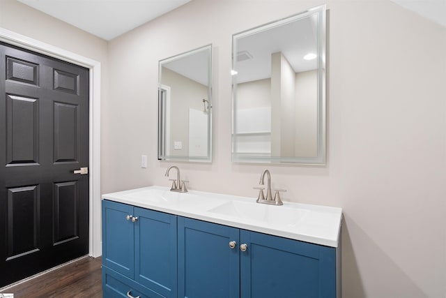 bathroom with vanity and hardwood / wood-style floors