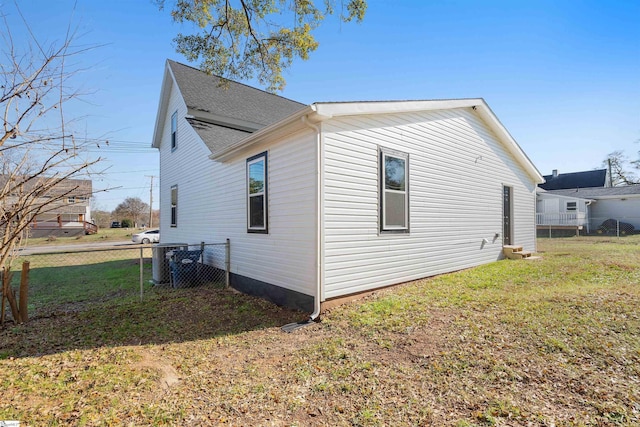 view of home's exterior featuring a yard