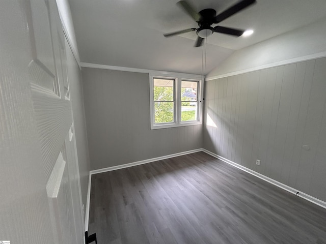 unfurnished room with lofted ceiling, dark hardwood / wood-style floors, and ceiling fan