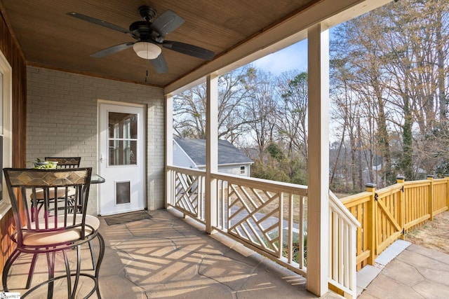 exterior space featuring ceiling fan