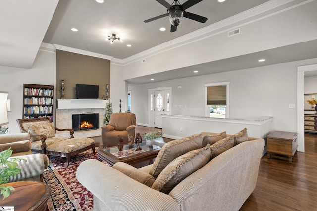 living room featuring ornamental molding, dark hardwood / wood-style floors, and ceiling fan