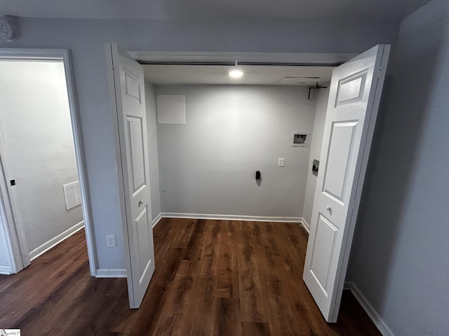 laundry area with dark hardwood / wood-style floors and washer hookup