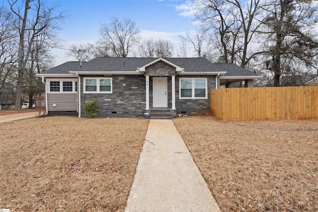 ranch-style home featuring a front lawn